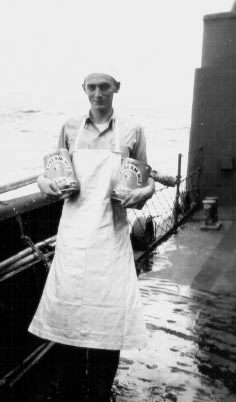 Lt Hill ready to make some ice cream; 25DEC1943.