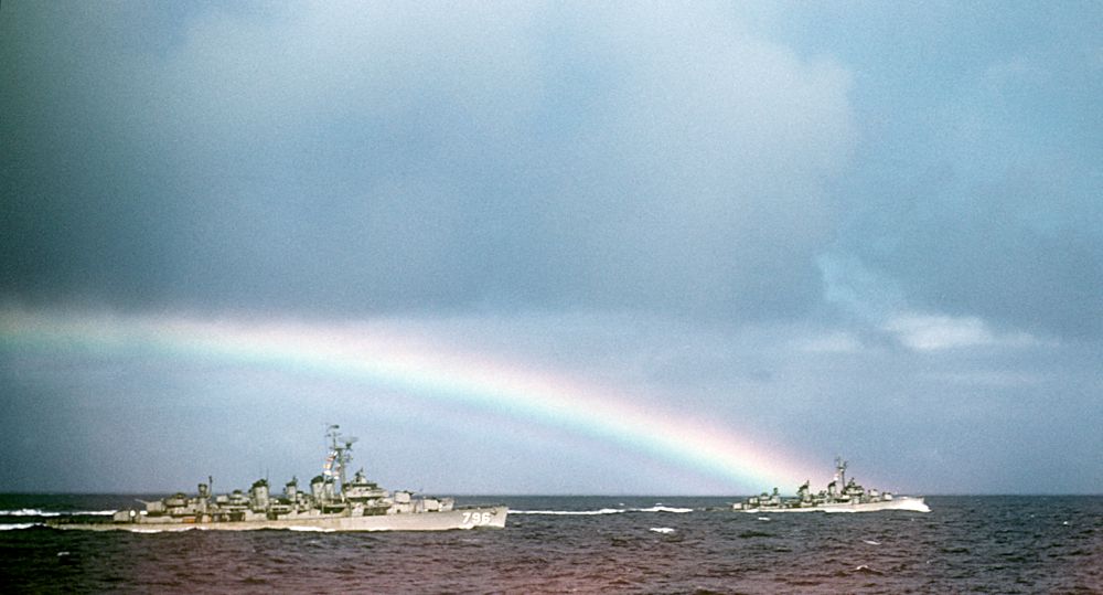 Rainbow over two screening DDs